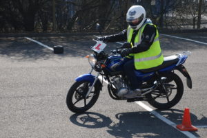 Motorcycle training with learner sign and safety gear