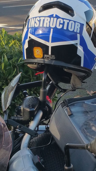 An instructor's helmet placed on a motorcycle